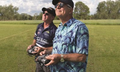 Using a buddy-box setup, Dave Scott (left) helps a student become a better RC pilot.