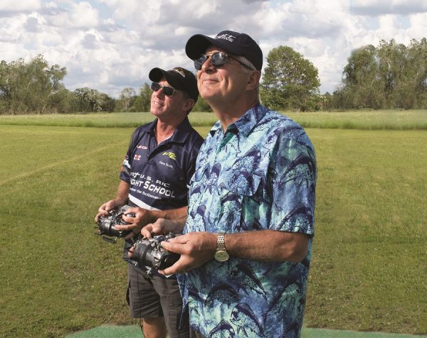 Using a buddy-box setup, Dave Scott (left) helps a student become a better RC pilot.
