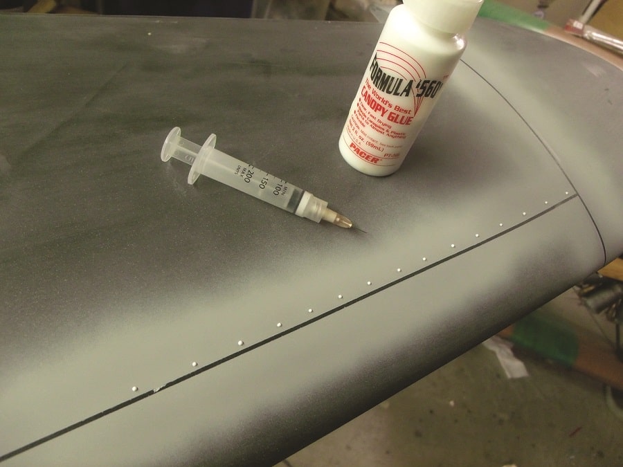 Here, you can see some fresh raised rivets applied using Zap Formula 560 Canopy Glue. After the glue has dried, the surface can be painted.