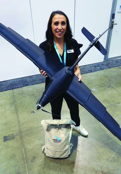Michelle Madaras, the chief customer officer at WingXpand shows off her company’s new product: a fixed-wing drone with a seven-foot wingspan that can be disassembled and collapsed to fit inside a small backpack.