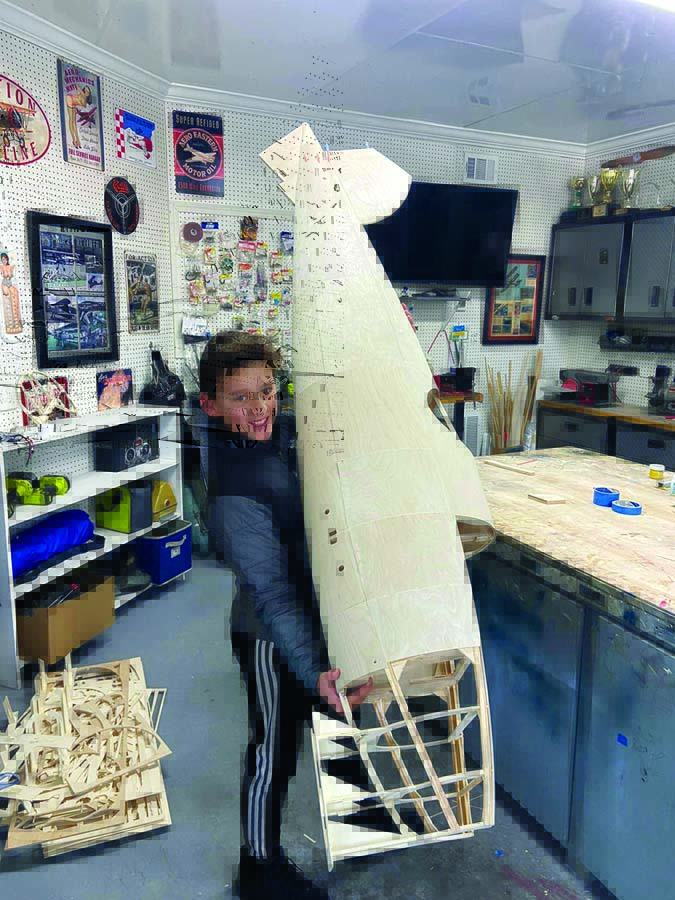 Pedro’s son Alex is very excited holding the nearly complete fuselage. 