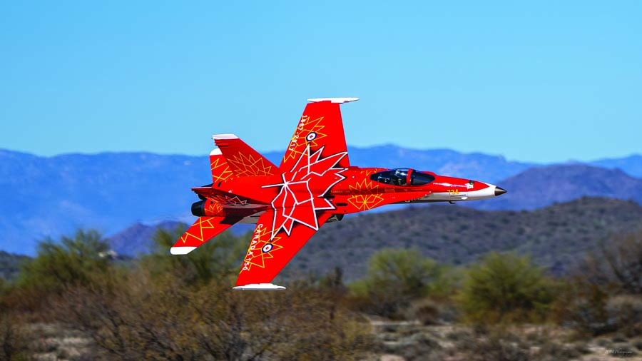 Barry Hinrichs 1/6-scale BVM F-18 sporting the Canadian Air Force demonstration livery. The paint scheme punctuated the late afternoon skies, evocative of ultra- scale performance. (Photo by Doug Ringering)