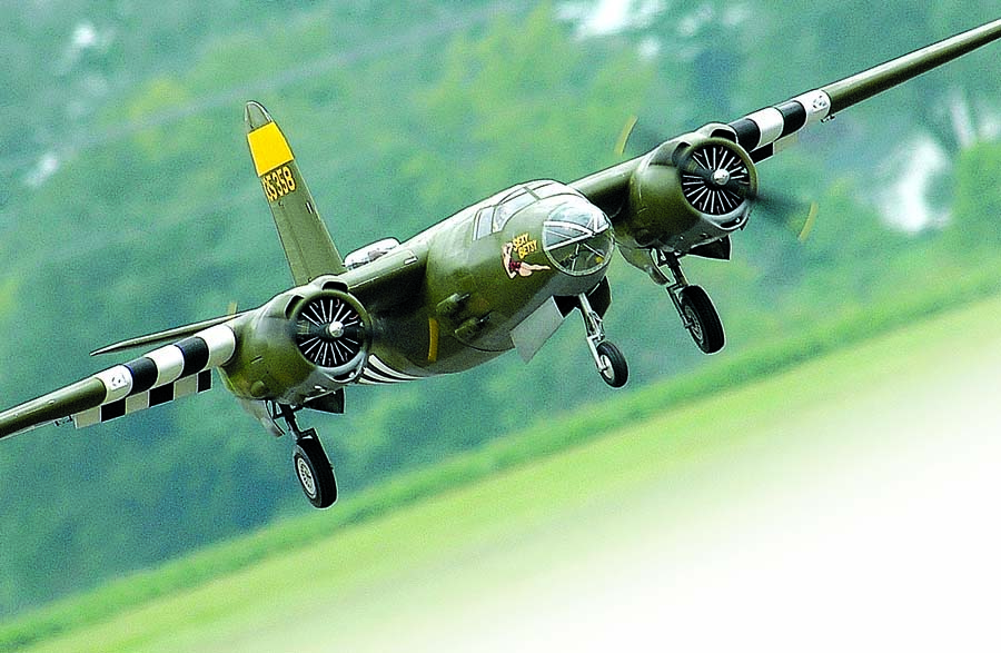 Twin-engine aircraft, especially WW II military warbirds are exciting and always draw a crowd. Here, Paul LeTourneau’s monster B-26 comes in for a landing. Paul enlarged Jerry Bates plans to a 170-inch span, and he powers the Marauder with a pair of Desert Aircraft DA-100 gas engines.