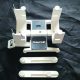 The contents of the box include the stand and digital scale and adapters for measuring different size wing chord models.