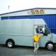 Bryan Kennedy strikes a pose with Skylab II, his customized RC plane hauler and workshop.