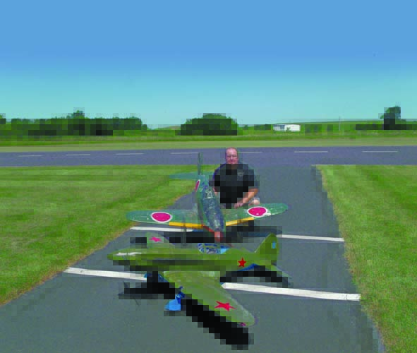 The author shows off his competition-worthy ARFs, a MiG-3 (foreground) and Mitsubishi J2M. When picking a subject for scale competition, you can gain a little edge by choosing an unusual subject plane. The judges see a lot of Mustangs and Hellcats, so get noticed for having something different.